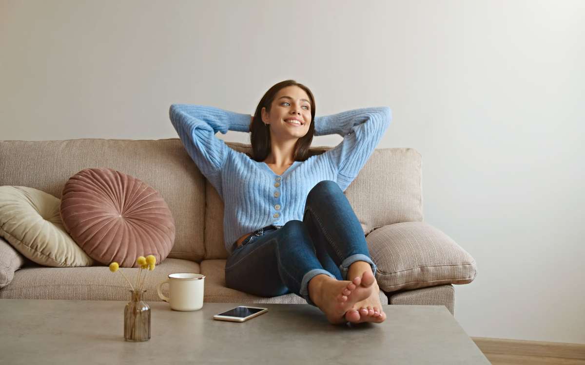 Resident chilling in her living room at Lakewood Manor Apartments in Rochester, New York