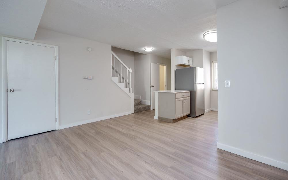 Unfurnished living room with refrigerator at Maple Oaks in Middletown, Ohio