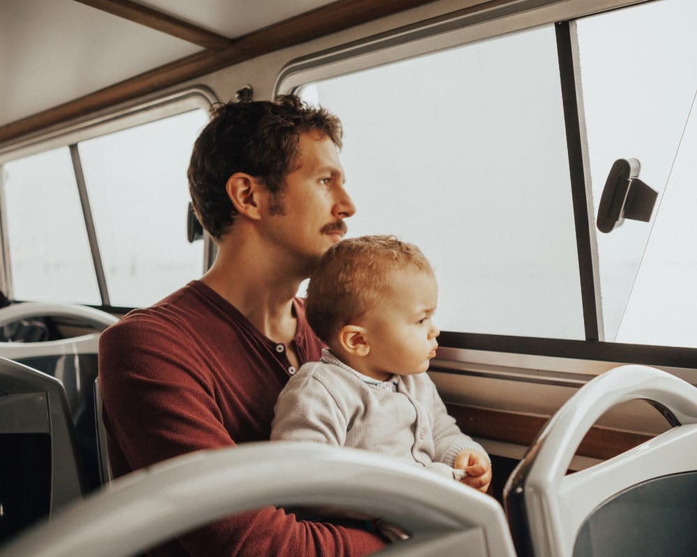 a resident on the bus with their infant near Coral Sea Cove in Port Hueneme, California