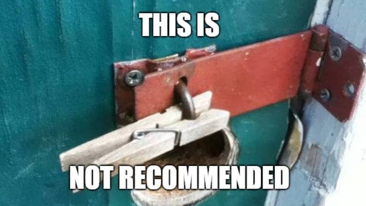 A wooden clothespin used to secure a door latch, in place of a lock.