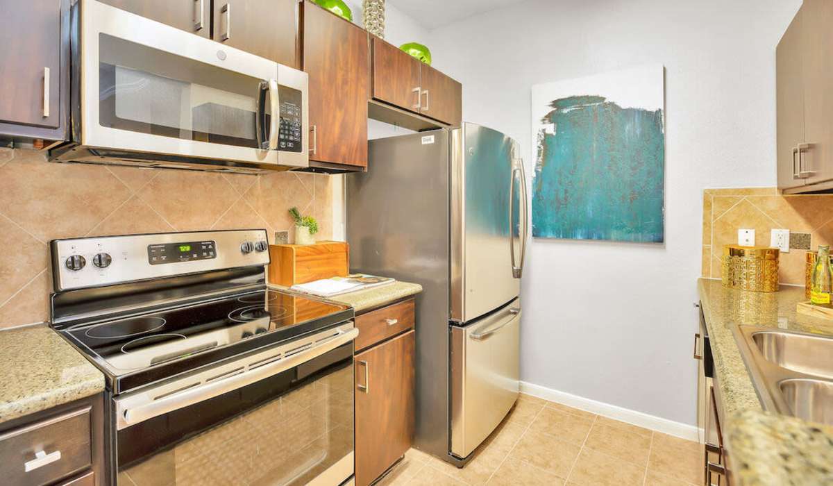 Kitchen with stainless-steel appliances at The Fuse at Park Row in Houston, Texas
