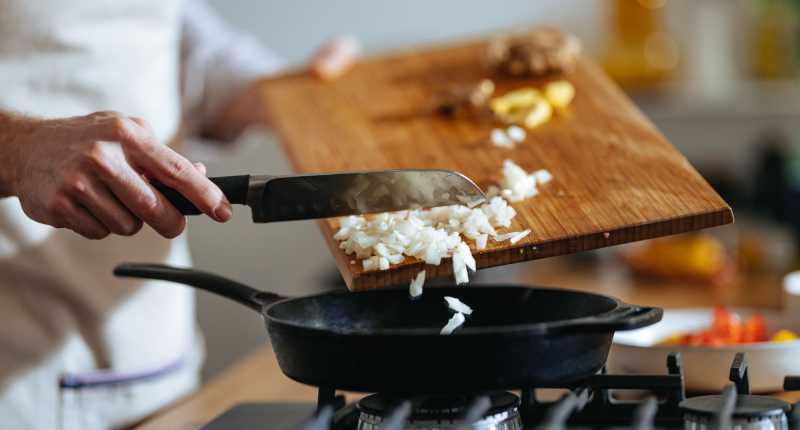 Resident preparing food in the kitchen at Global Ruston in Ruston, Louisiana