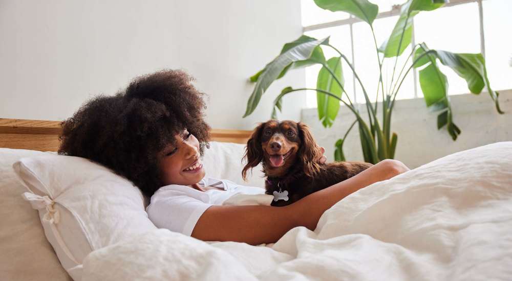 A resident and her pet dog at Falcon House in Fort Walton Beach, Florida