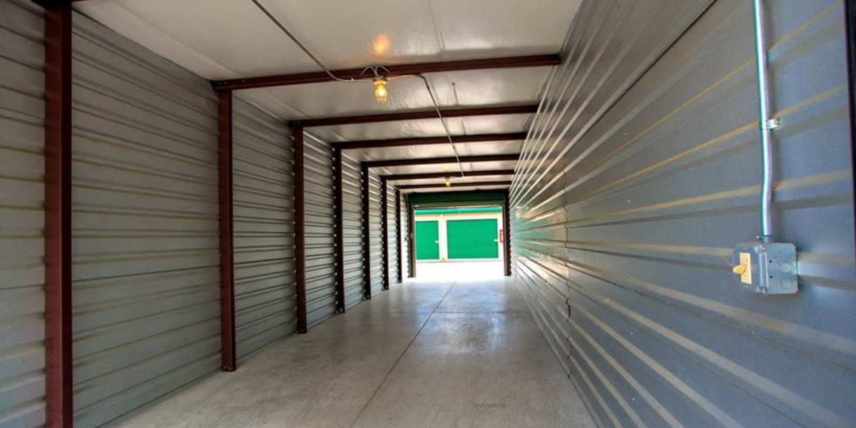 A covered hallway between outdoor units at Neighborhood Self Storage. 