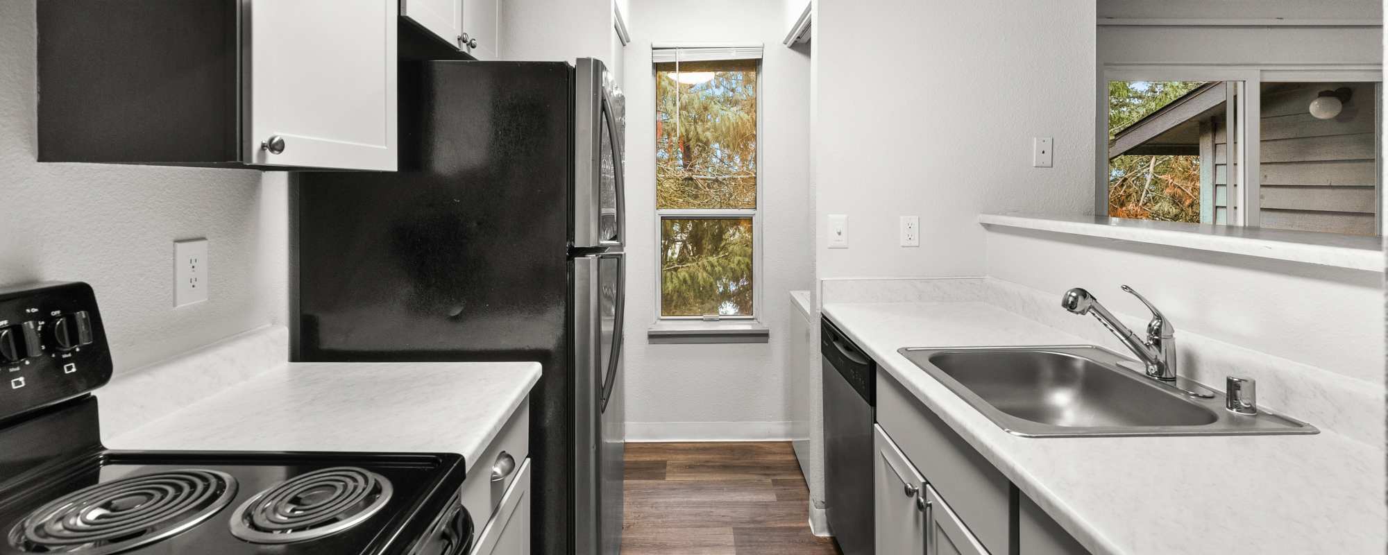 Apartment kitchen at Lodge at Madrona Ridge in Tacoma, Washington