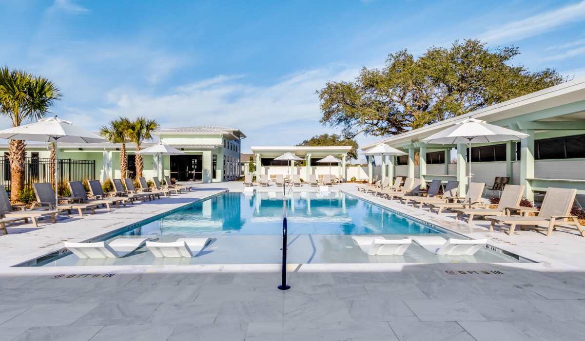 Community swimming with lounge seating at Trinity Villas in Lafayette, Louisiana