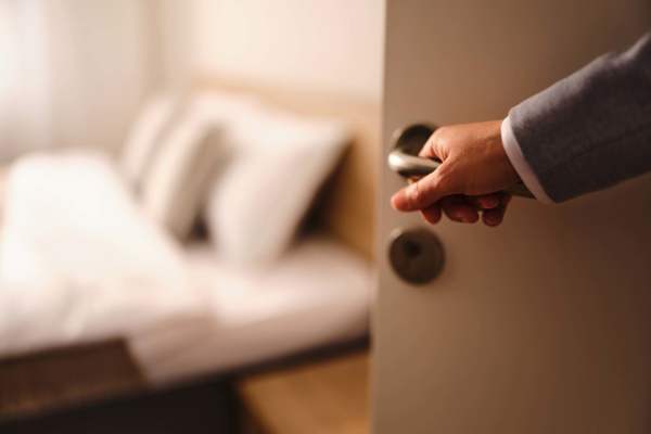 Man opening a door at Raystone Apartments in Phoenix, Arizona
