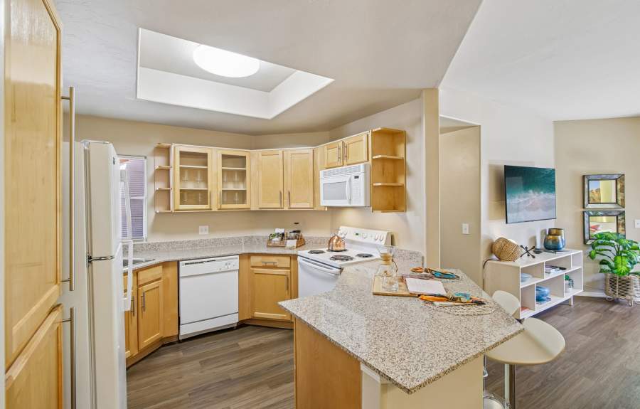 Kitchen with White Appliances & Granite Countertops at The Golf Villas at Oro Valley in Tucson, Arizona