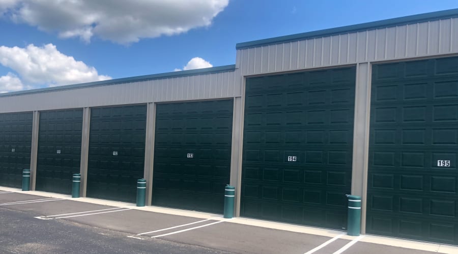 Outdoor storage units with green doors at KO Storage of Clearwater in Clearwater, Minnesota