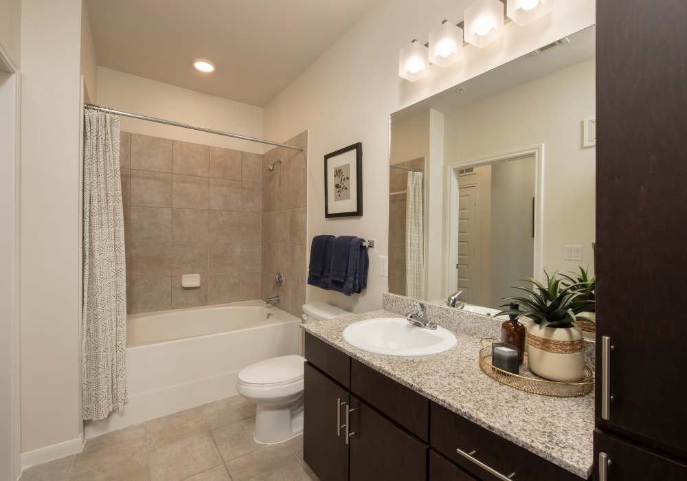 Bathroom with tile flooring  and bath assets at Nantucket at Fannin Station in Houston, Texas