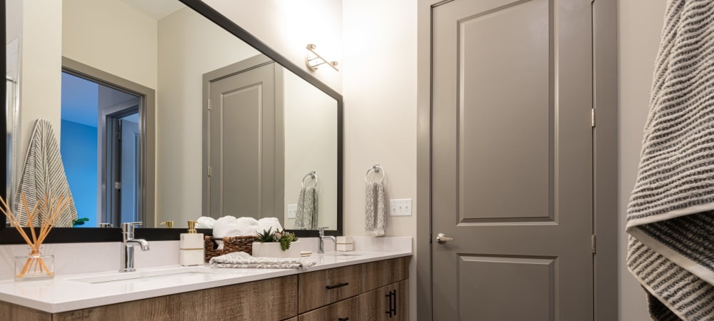 Spacious bathroom with oversized vanity and ample counter space at The Reserve at Patterson Place in Durham, North Carolina