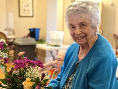 Happy senior woman at Eastern Star Masonic Retirement Campus in Denver, CO