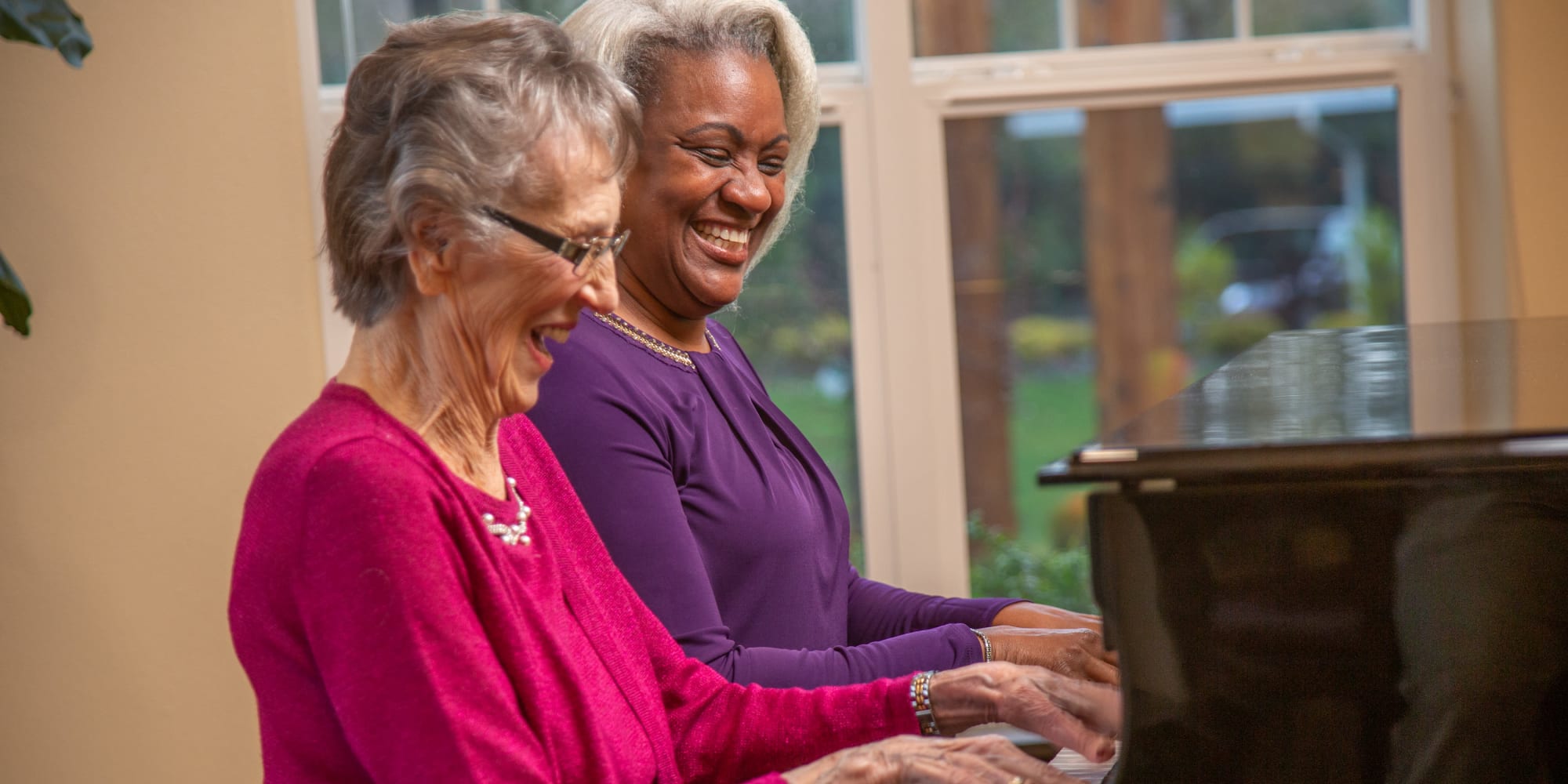 Residents from Azalea Estates Gracious Retirement Living in Chapel Hill, North Carolina playing the piano