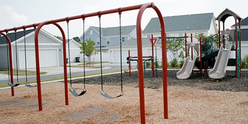 the playground swings at The Village at New Gosport in Portsmouth, Virginia