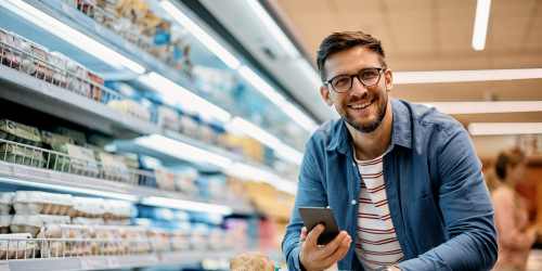 Resident shopping for groceries in a supermarket near Reidy Creek Apartments in Escondido, California