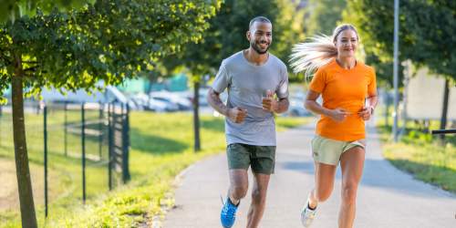 Residents jogging in a lush green park near The Marina in Modesto, California