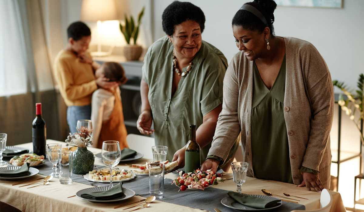 A family setting the table for dinner together at Copper Stone in Lafayette, Colorado