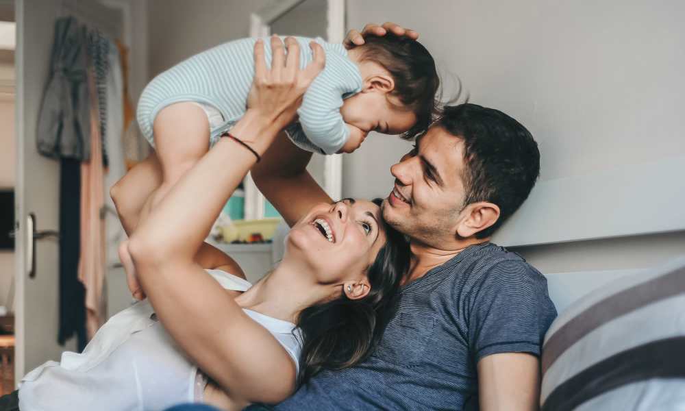 Family laying in bed at Lafayette Housing and Development Agency in Lafayette, Tennessee