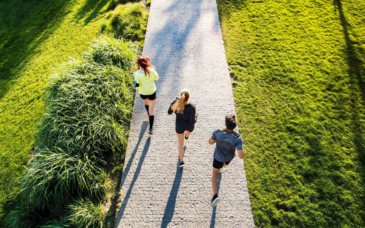 Resident running in park near The Acacia in Palo Alto, California