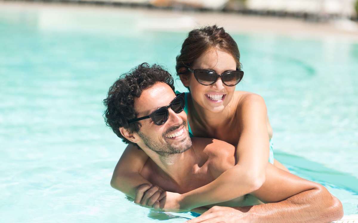 Residents cooling off in the outdoor swimming pool at Dakota San Antonio in San Antonio, Texas