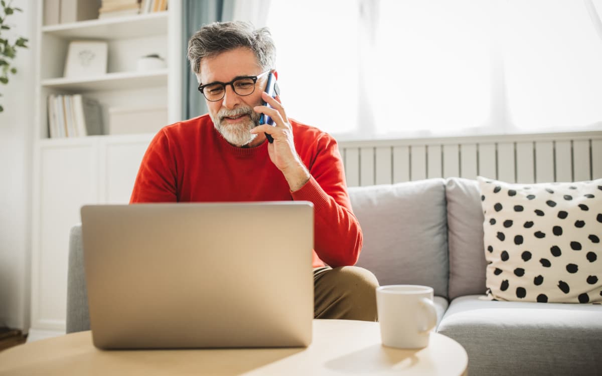 Resident using laptop at Huntington Place in Trumbull, Connecticut