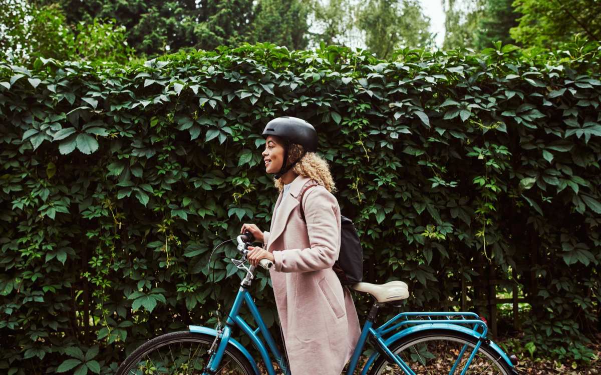 Resident riding a bicycle in a park near Yale Street Commons in Bridgeport, Connecticut