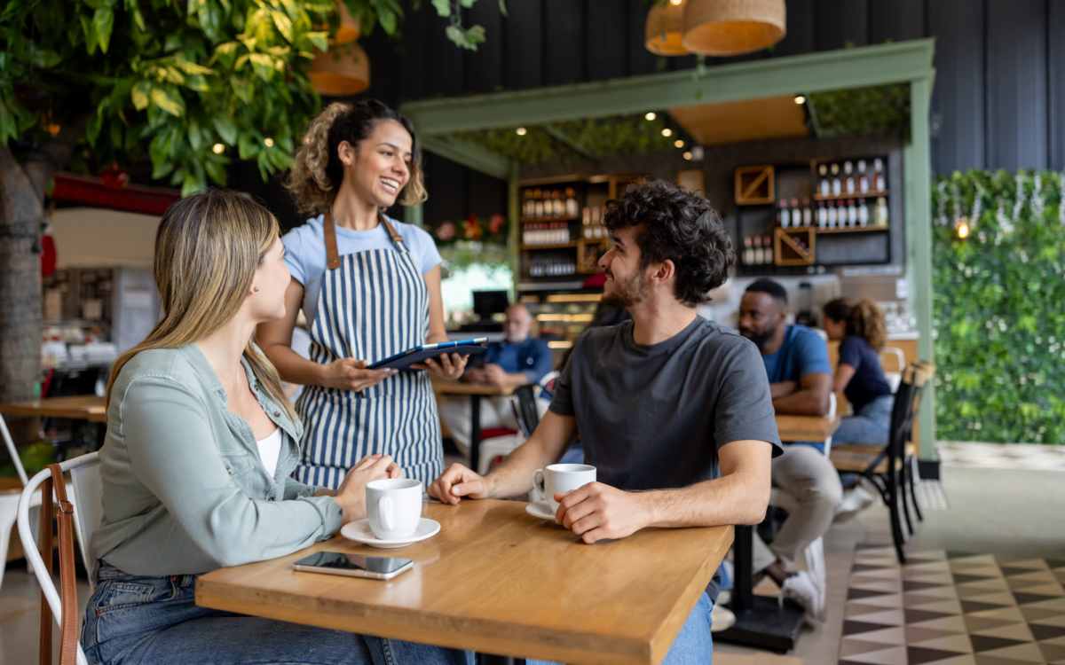Resident couple placing order in restaurant near Lake Carlton Arms in Lutz, Florida