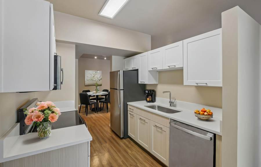 Apartment Kitchen and Dining Table at Oro Vista Apartments in Oro Valley, Arizona