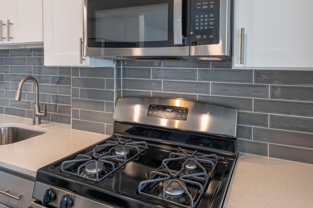 Model kitchen with stainless-steel oven at Ruxton Towers Apartments in Towson, Maryland