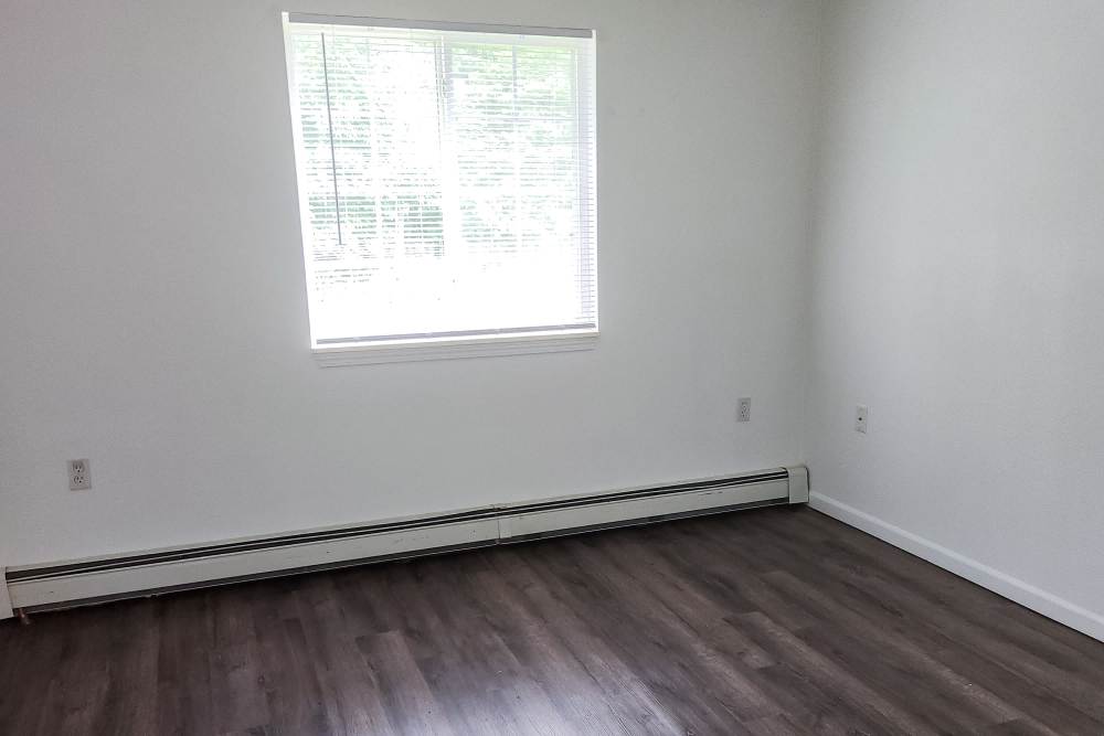 Unfurnished bedroom with window at Bramblewood in New Haven, Michigan