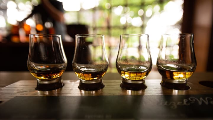Bourbon flight with selective focus on four samples