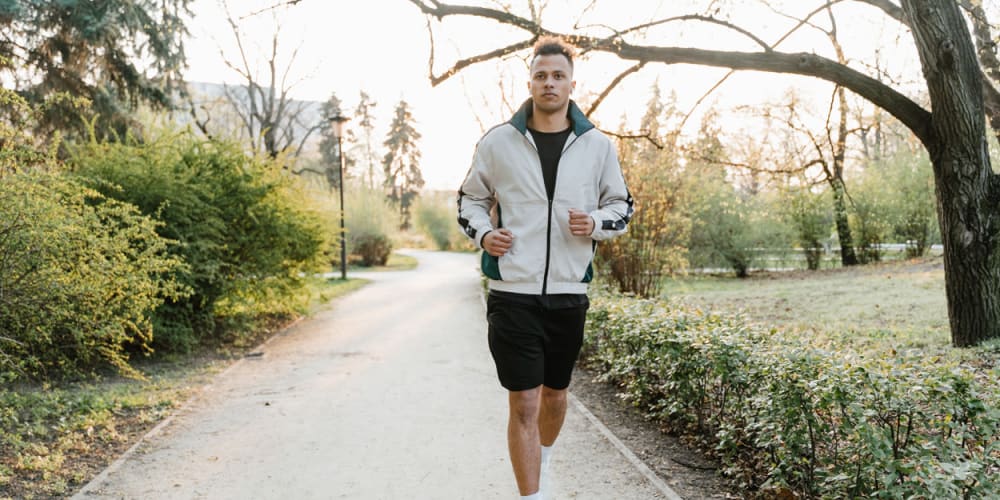 Resident running through a park near Bon Aire Apartments in Castro Valley, California