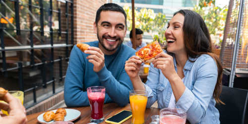 Residents enjoying a pizza feast at their favorite restaurant near Comanche Hills in La Mesa, California