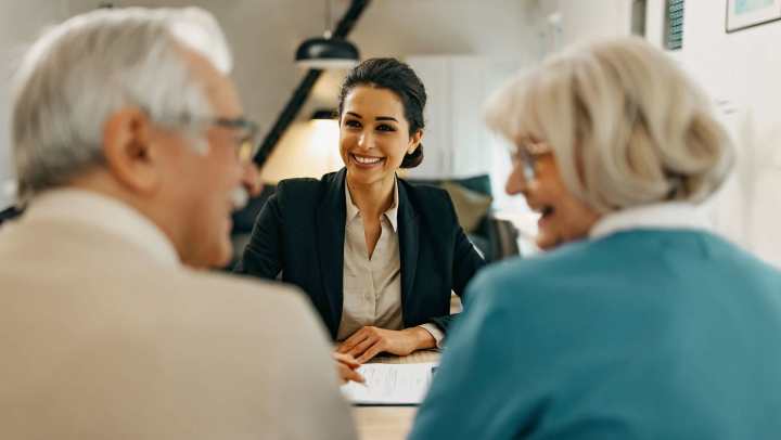 Old man and woman consulting with a consultant