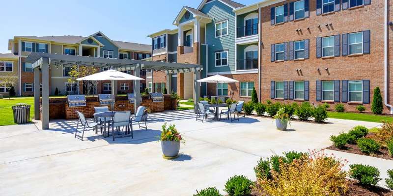 Courtyard with grilling station at City Limits Apartments in Columbia, Tennessee