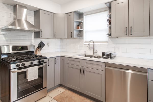 Kitchen with appliance at Embry Apartments in Carrollton, Texas