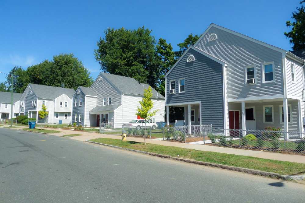 Residential homes with front yards near E. Henry Twiggs Estates Phase I in Springfield, Massachusetts 
