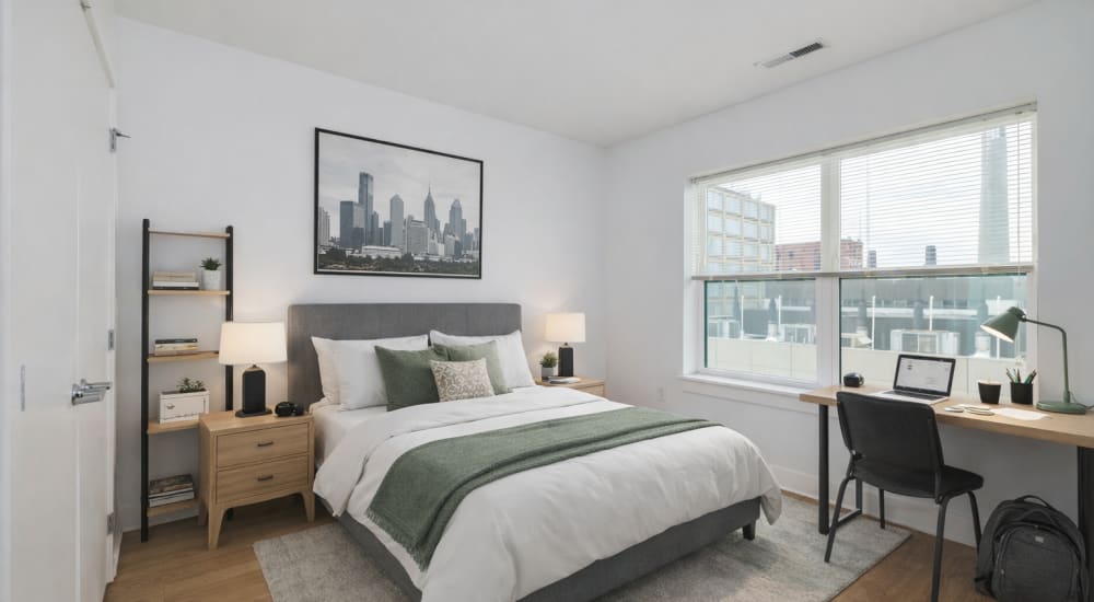 Bedroom with large windows featuring two windows at NC Five in Philadelphia, Pennsylvania