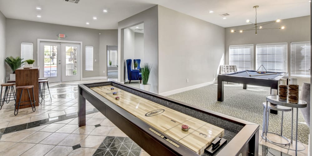 Billiards and shuffleboard table at Arroyo Grande Apartments in Henderson, Nevada