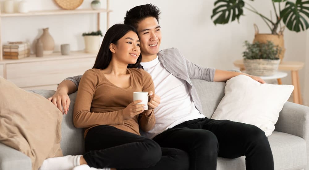 Resident couple smiling in their home at Riverstone Apartments in Sacramento, California