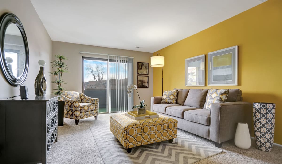 Living room with modern furnishings at Canterbury Green in Fort Wayne, Indiana