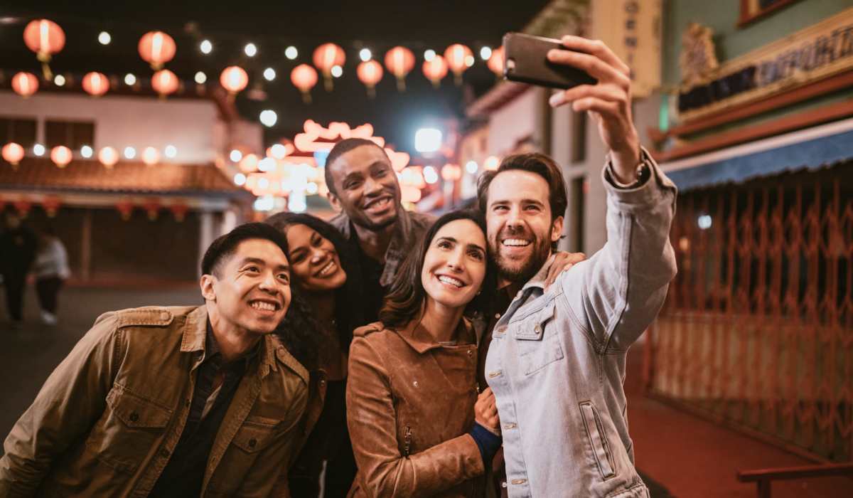 Friends taking a selfie near Brentwood Apartments in Portland, Oregon
