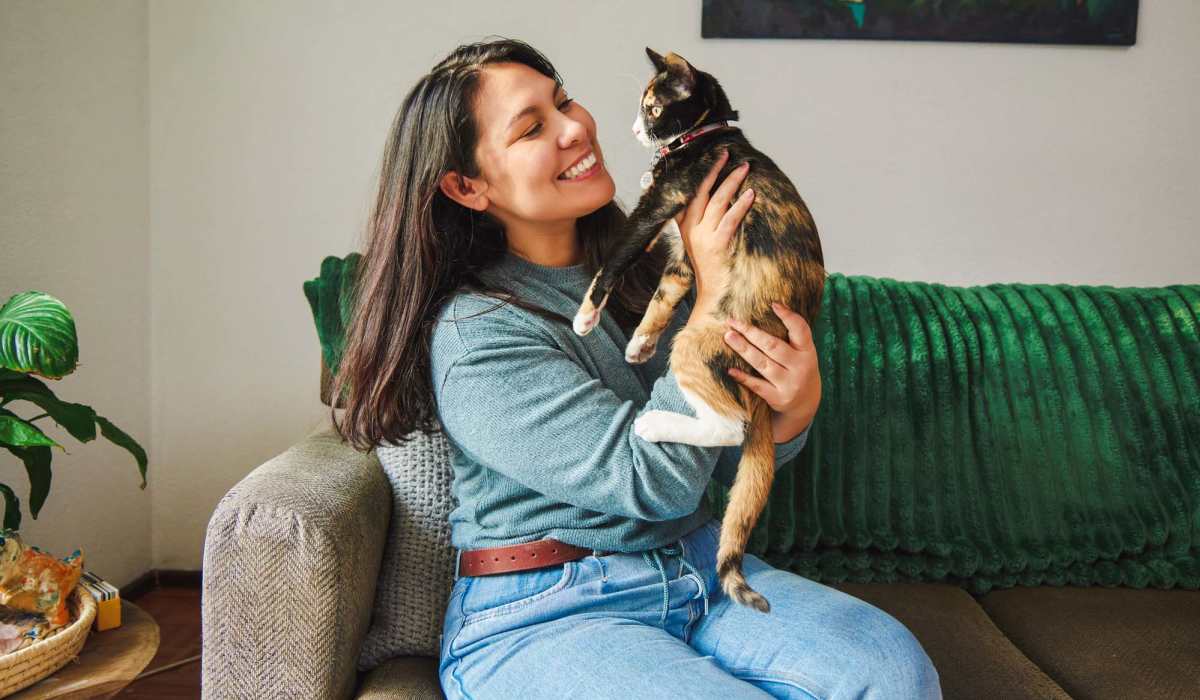 Woman holding her cat at The Tuscany On Pleasant View in Madison, Wisconsin