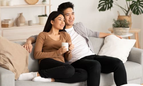 Couple on their couch at Adelaide Pines in Concord, California