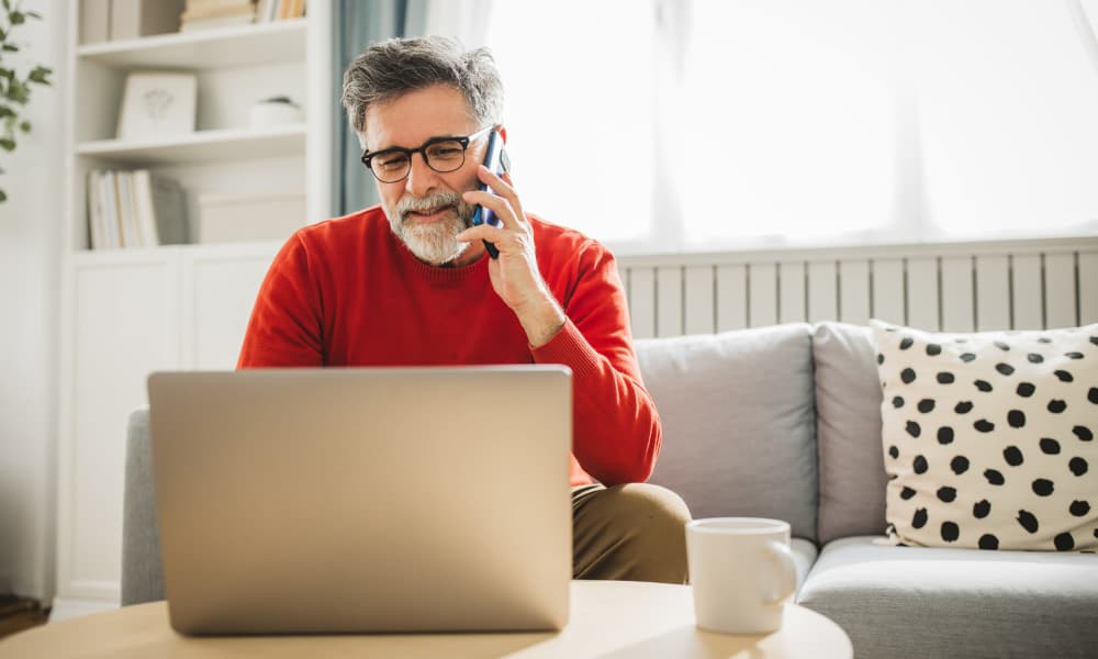 Resident using online services at Pin Oak Village in Bowie, Maryland