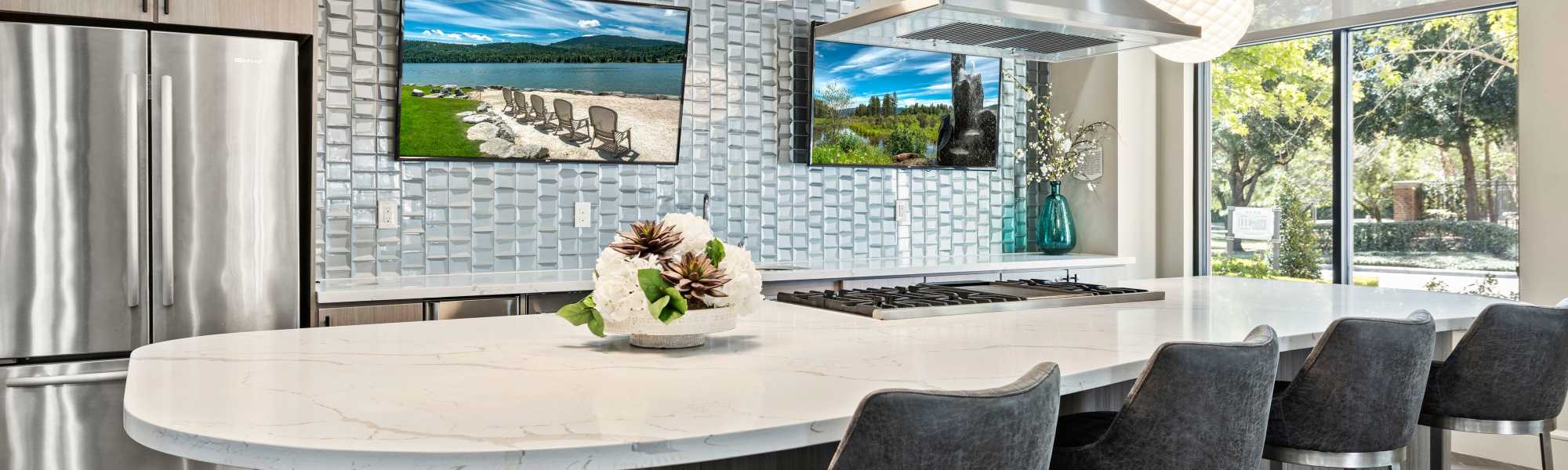 Kitchen and dining area at Olympus at Memorial in Houston, Texas