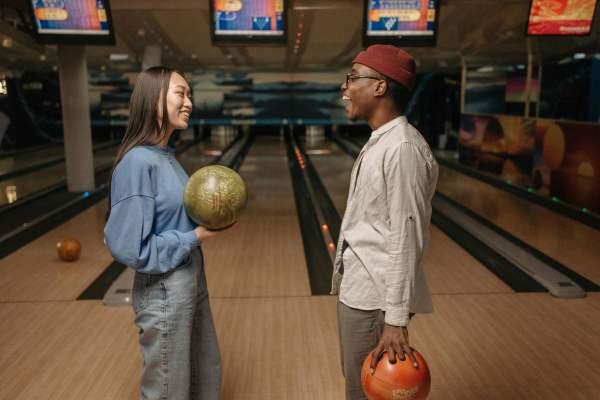 Friends playing bowling near Paseo Park in Glendale, Arizona