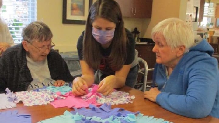 Harvester Place Memory Care residents with local high school students