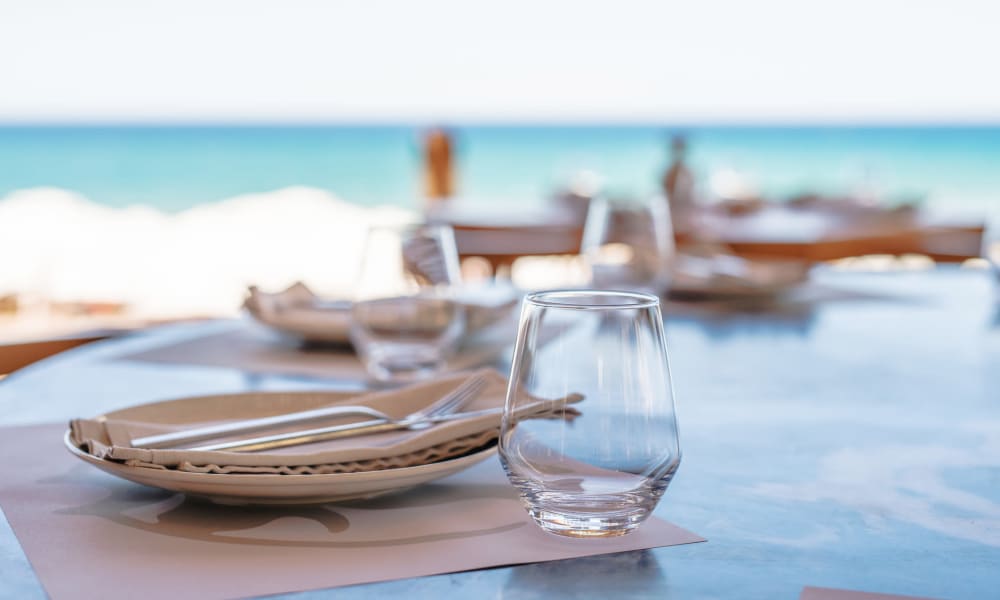 Tables set a seaside restaurant near The Villa at Marina Harbor in Marina del Rey, California