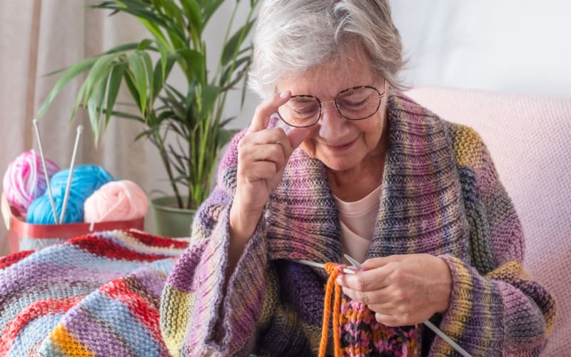 Resident knitting at Grand Villa of Clearwater in Clearwater, Florida